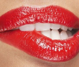 The signature Hollywood Smile finish. Hollywood Smile with bright white veneers and red lips, Smile Infinity Beirut, Lebanon